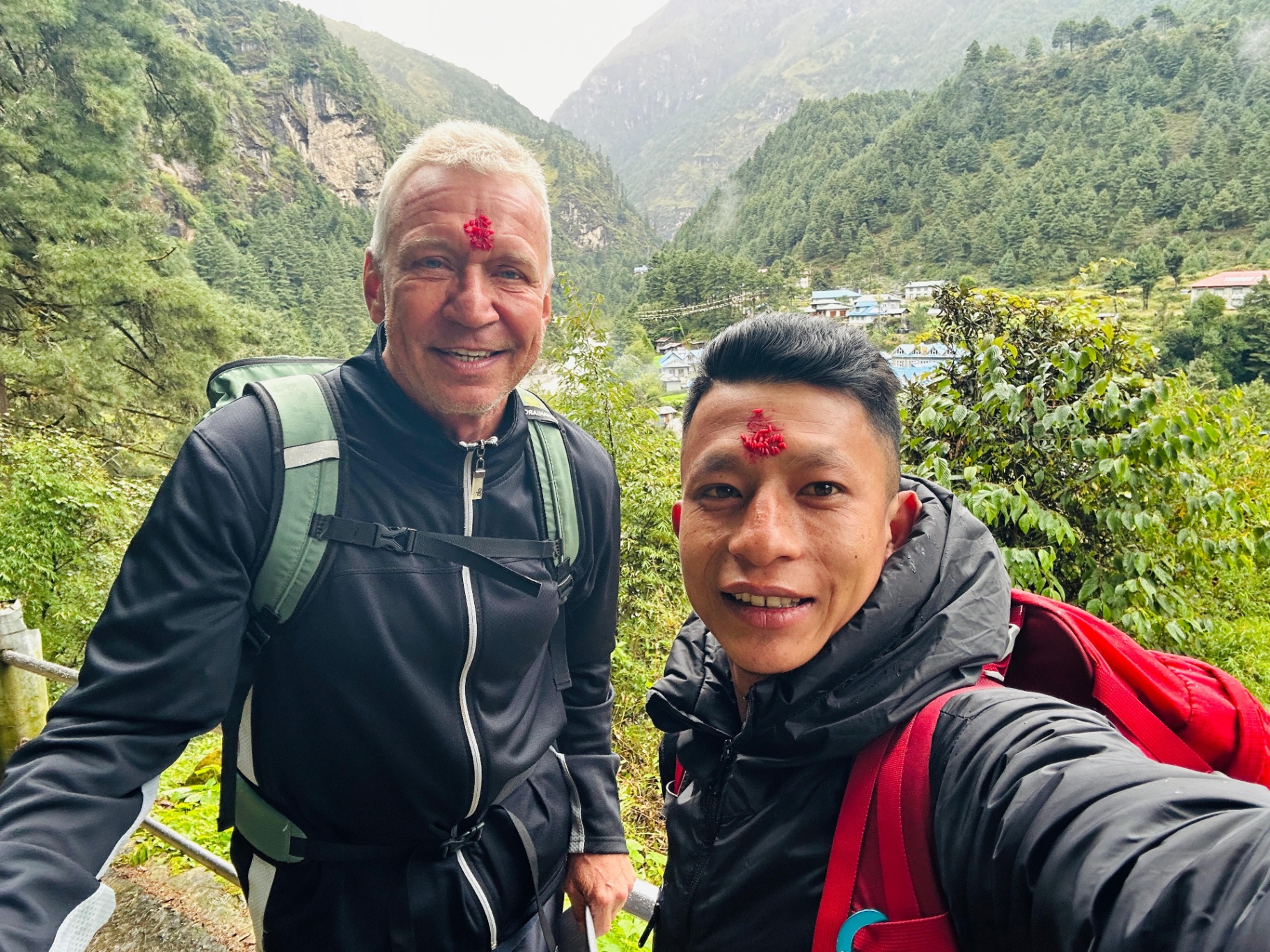 Bhupal with a trekker, both wearing Dashain tika